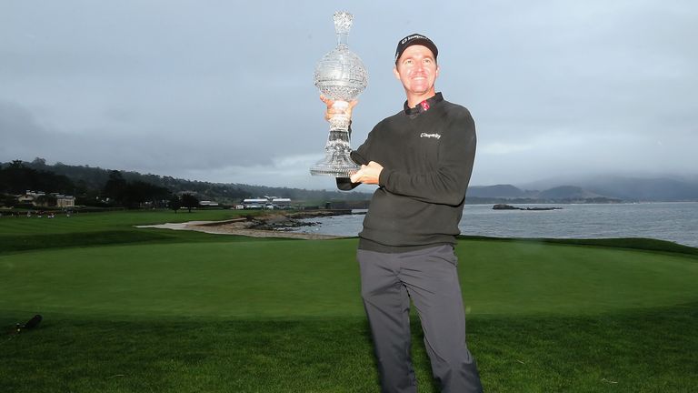 Jimmy Walker poses with the trophy after winning the AT&T Pebble Beach National Pro-Am at the Pebble Beach Golf Links