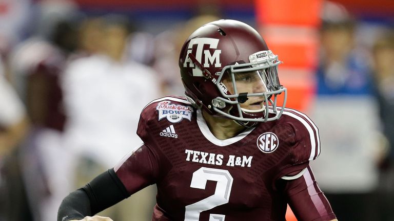 Quarterback Johnny Manziel of the Texas A&M Aggies rolls out and looks downfield to pass during the the Chick-fil-A Bowl