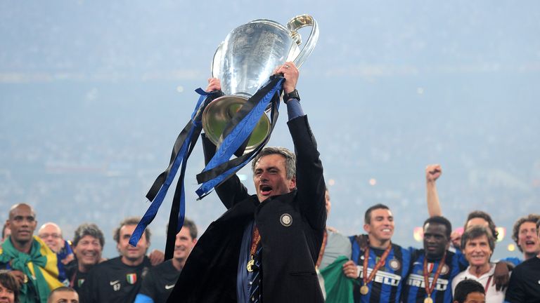 Jose Mourinho the Inter Milan coach holds the trophy aloft after winning the UEFA Champions League Final match between FC Bayern M