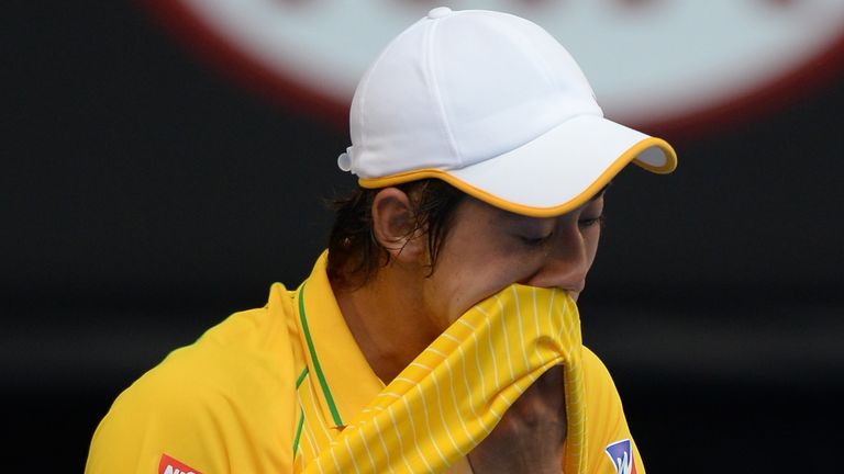 Japan's Kei Nishikori gestures during his men's singles match against Spain's Rafael Nadal on day eight of the 2014 Australian Open 