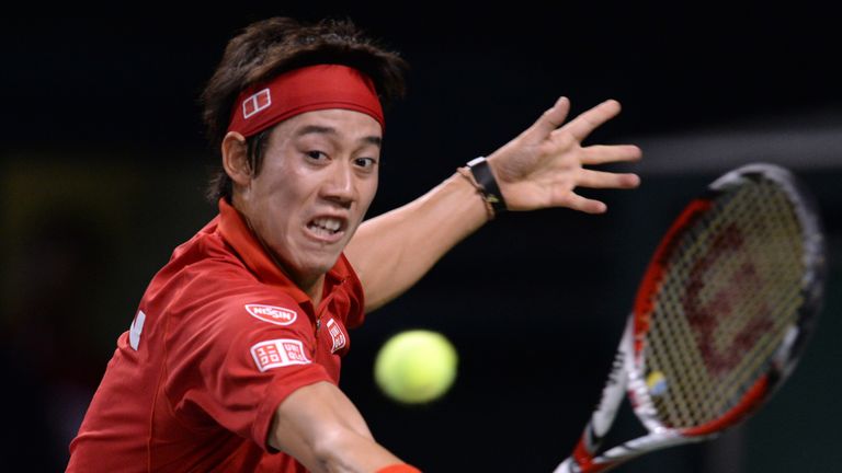 Kei Nishikori of Japan returns the ball to Frank Dancevic of Canada during their Davis Cup tennis 2014 World group first round match in Tokyo on February 2