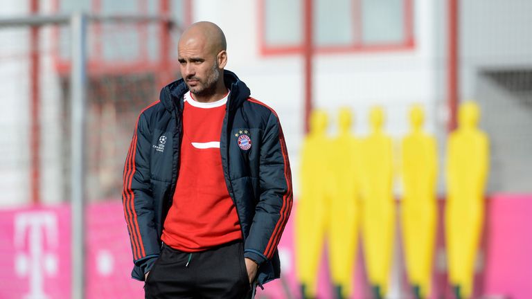 Bayern Munich's Spanish head coach Pep Guardiola watches the final training session at the trainings area in Munich, southern Germany, on February 18, 2013