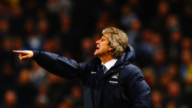MANCHESTER, ENGLAND - FEBRUARY 03:  Manuel Pellegrini manager of Manchester City gives instructions during the Barclays Premier League match between Manche