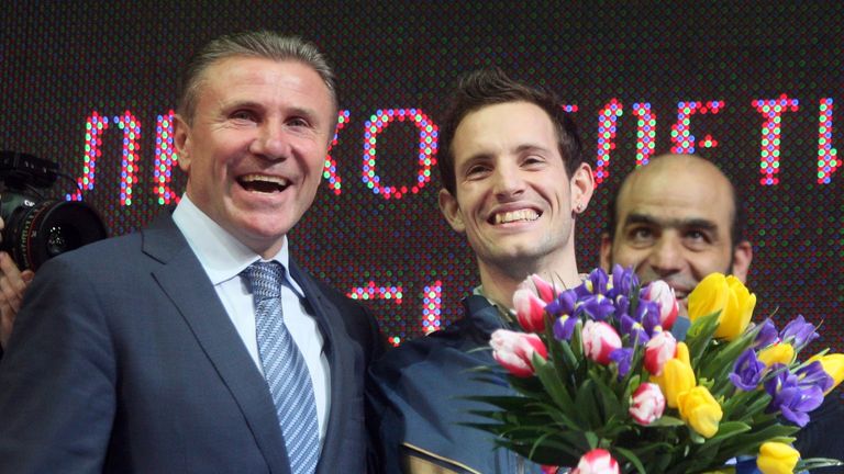Sergey Bubka (left) congratulates Renaud Lavillenie on breaking his indoor pole vault world record