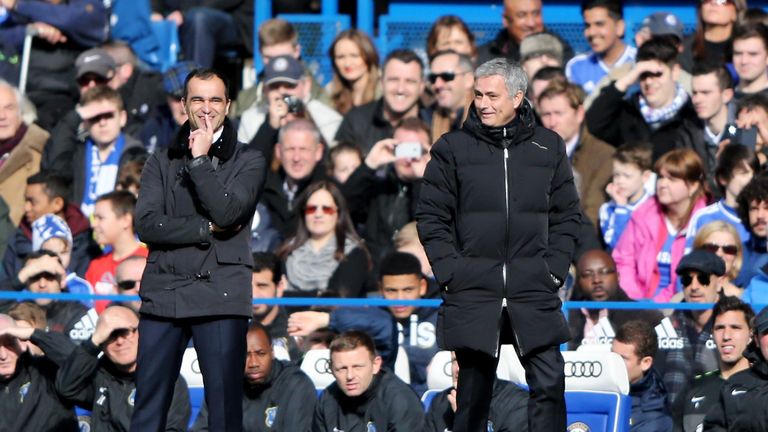 Roberto Martinez (L) manager of Everton and Jose Mourinho manager of Chelsea look on from the touchline at Stamford Bridge