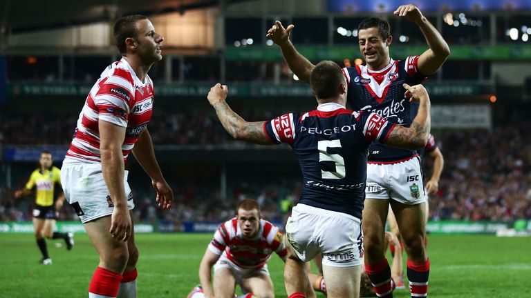 Shaun Kenny-Dowall of the Sydney Roosters celebrates with Anthony Minichiello after scoring a try against the Wigan Warriors in the World Club Challenge