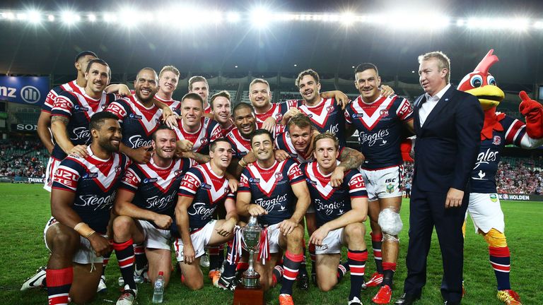 Sydney Roosters celebrate victory with the World Club Challenge trophy after defeating Wigan Warriors