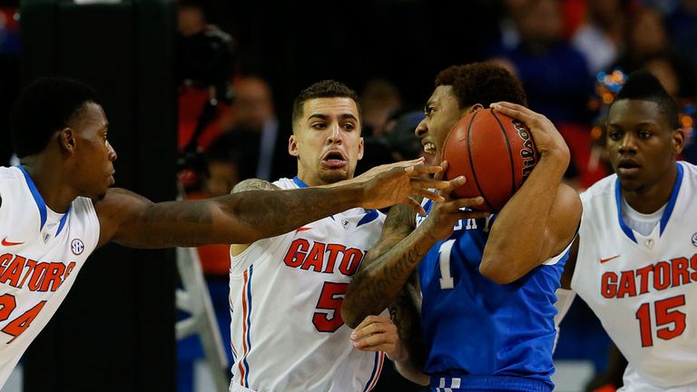 Kentucky's James Young contends with Florida's Casey Prather, Scottie Wilbekin and Will Yeguete