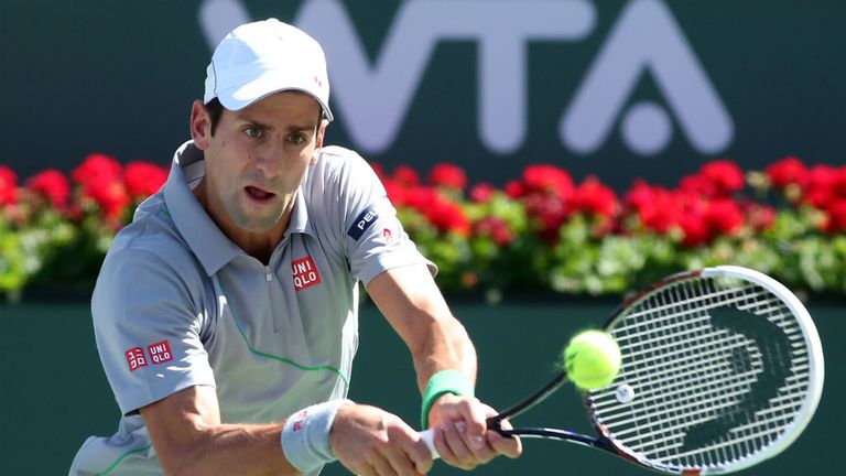 - Novak Djokovic of Serbia chits a return to Benneteau of France during the BNP Paribas Open at Indian Wells Tennis Garden 2014