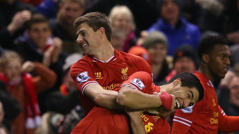  Steven Gerrard of Liverpool celebrates scoring the first goal with team-mate Luis Suarez