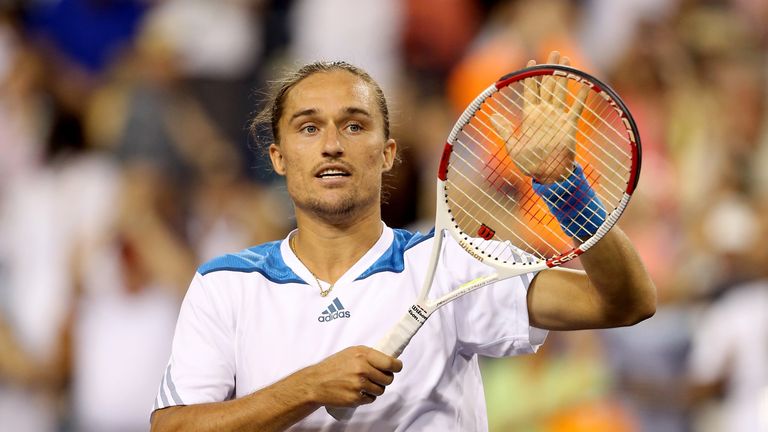 Alexandr Dolgopolov of Ukraine celebrates his win over Rafael Nadal of Spain during the BNP Parabas Open at the Indian Wells 