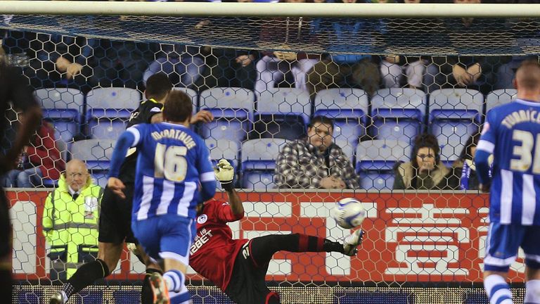 Wigan's Ali Al-Habsi saves a penalty from Sheffield Wednesday's Leon Best 