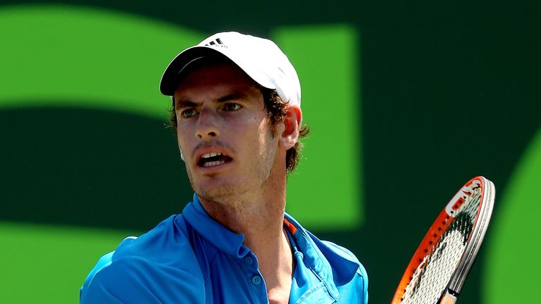 Andy Murray of Great Britain returns a shot to Feliciano Lopez of Spain during the Sony Open