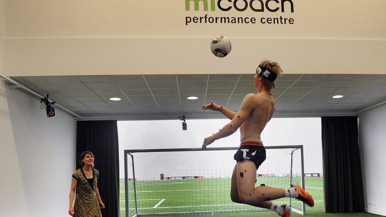 An athlete with sensors stuck to his body prepares to play football in the new Ajax miCoach Performance Centre in Amsterdam on April 29, 2011.