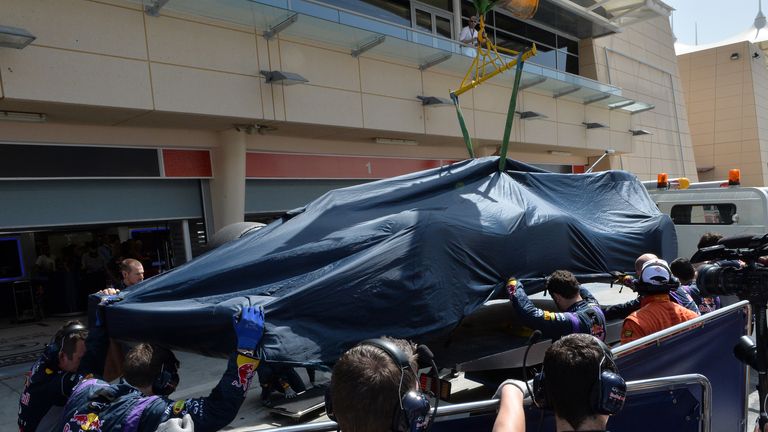 The RB10 of Sebastian Vettel is recovered after his first breakdown