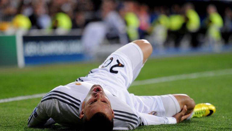MADRID, SPAIN - MARCH 18:  Jese of Real Madrid lies injured following a heavy tackle during the UEFA Champions League Round of 16, second leg match between