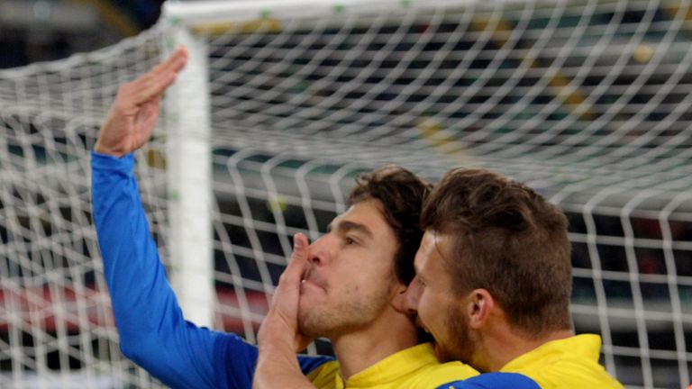 Alberto Paloschi (L) of Chievo Verona celebrates after scoring his opening goal