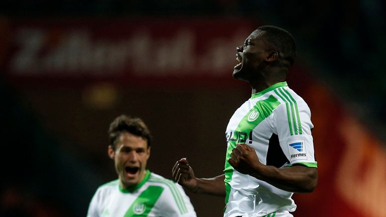 Junior Malanda of Wolfsburg celebrates after scoring his team's first goal during the Bundesliga match between Werder Bremen and Wolfsburg