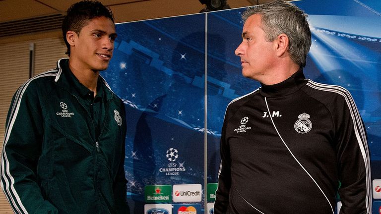 MADRID, SPAIN - APRIL 02:  Head coach Jose Mourinho (R) and Real Madrid player Raphael Varane