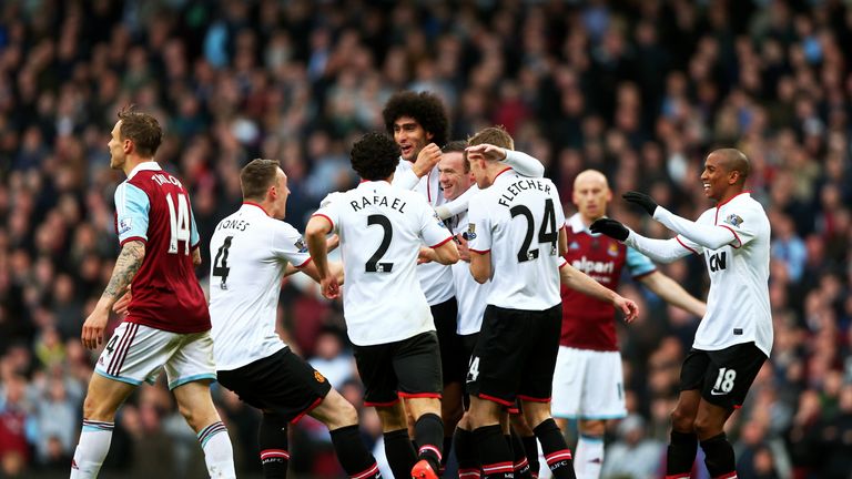 Wayne Rooney is congratulated after scoring from long range against West Ham