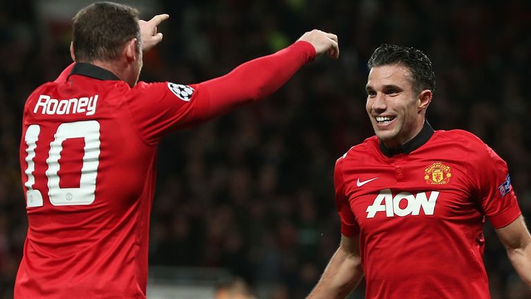 Robin van Persie of Manchester United celebrates scoring their second goal against Olympiakos
