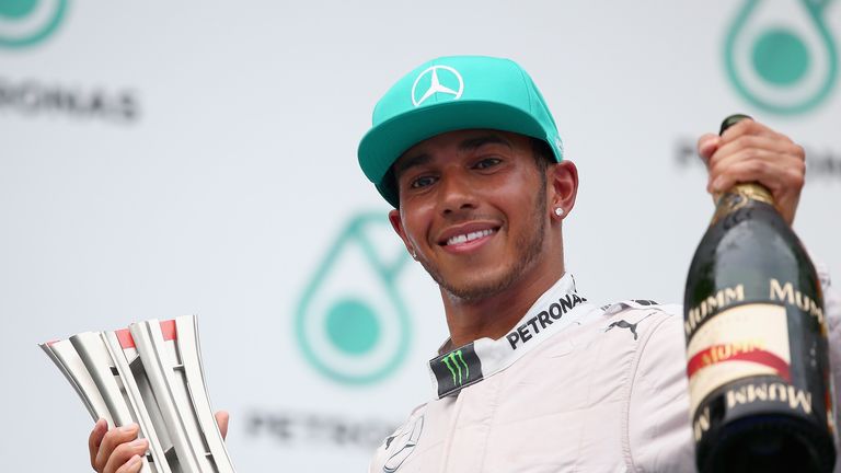Lewis Hamilton celebrates his win