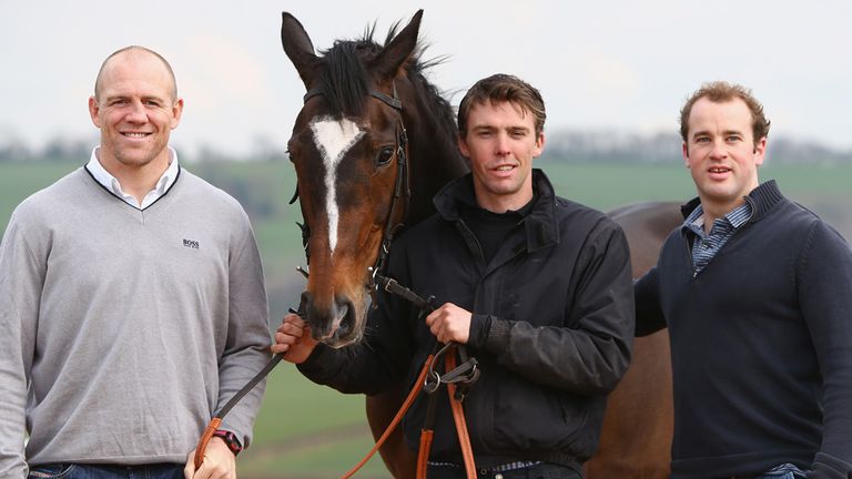 Michael Scudamore (C) poses alongside Mike Tindall (L) and James Simpson-Daniel (R) with Monbeg Dude