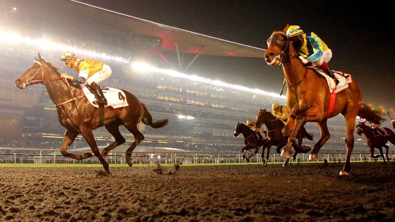 DUBAI, UNITED ARAB EMIRATES - MARCH 29:  Sterling City (L) ridden by Joao Moreira wins the Dubai Golden Shaheen during the Dubai World Cup at the Meydan Ra