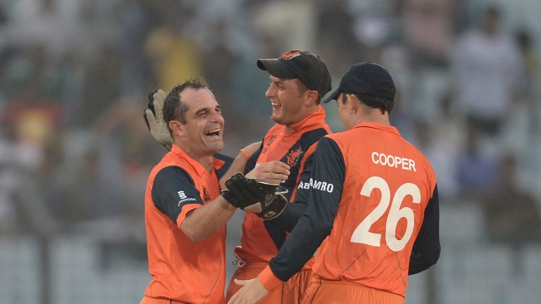 Peter Borren of the Netherlands celebrates with Wesley Barresi and Tom Cooper after dismissing Moeen Ali of England during the ICC World Twenty20