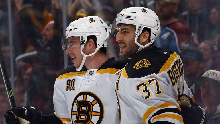 Patrice Bergeron #37 of the Boston Bruins celebrates his goal with Reilly Smith #18 of the Boston Bruins to take a 1-0 lead over th