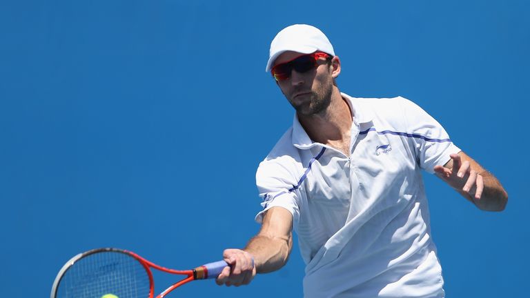 Ivo Karlovic  plays a forehand in his first round match against Ivan Dodig during day one of the 2014 Australian Open