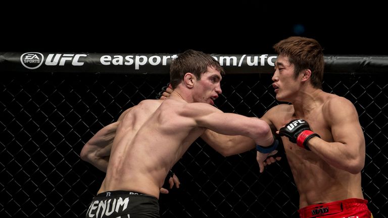 Dong Hyun Kim (R) of South Korea and John Hathaway (L) of England fight in their welterweight bout during the UFC Fight Night