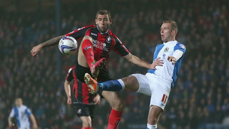 Jordan Rhodes of Blackburn Rovers in action with Steve Cook of Bournemouth 