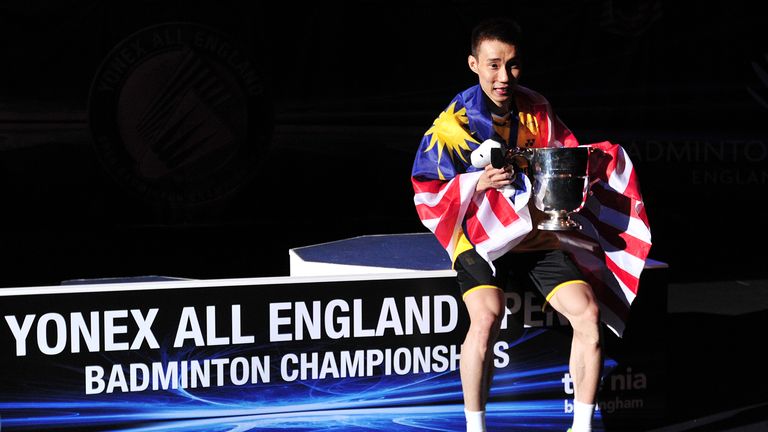 Lee Chong Wei of Malaysia poses with his trophy after beating Chen Long of China in their All England Open Badminton Championships