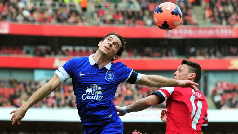 Mesut Ozil challenged Leighton Baines as Arsenal and Everton wrestled for control