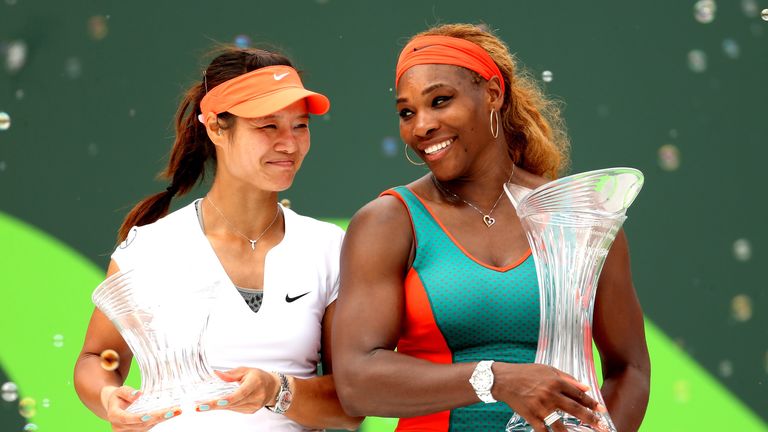 Li Na of China and Serena Williams pose for photographers after the final of the Sony Open