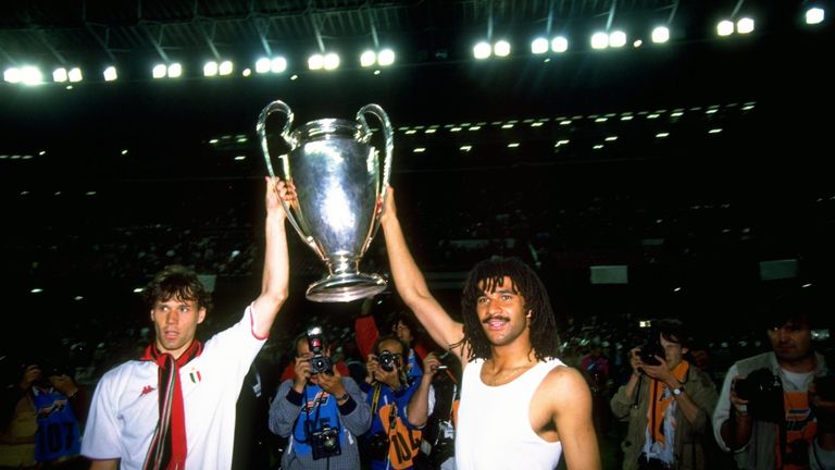 Marco Van Basten and Ruud Gullit of AC Milan celebrate with the trophy after winning the European Cup Final in 1989.