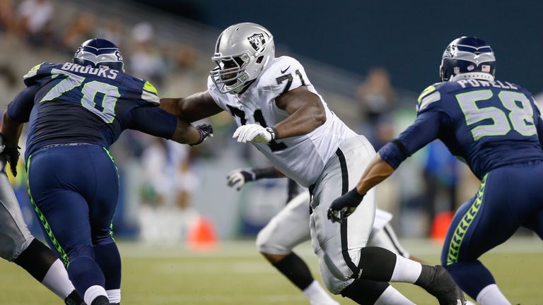Menelik Watson of the Oakland Raiders blocks against the Seattle Seahawks