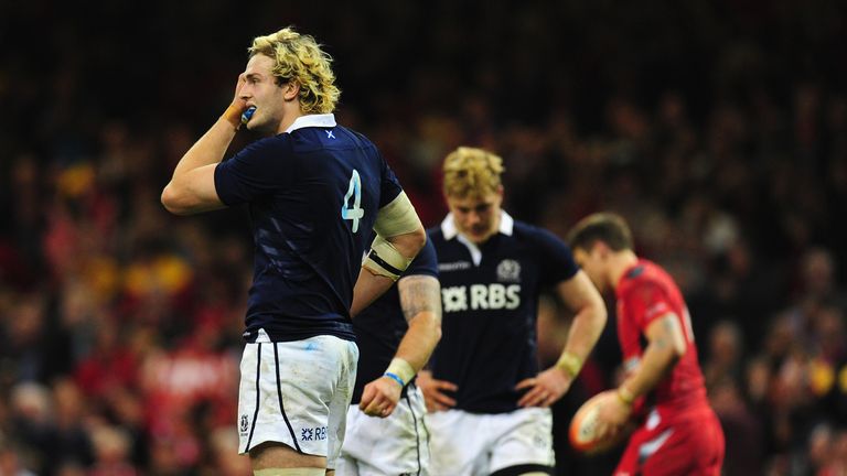 CARDIFF, WALES - MARCH 15: Richie Gray (l) of Scotland and team mates look on dejectedly after a Wales try during the RBS Six Nations match between Wales a