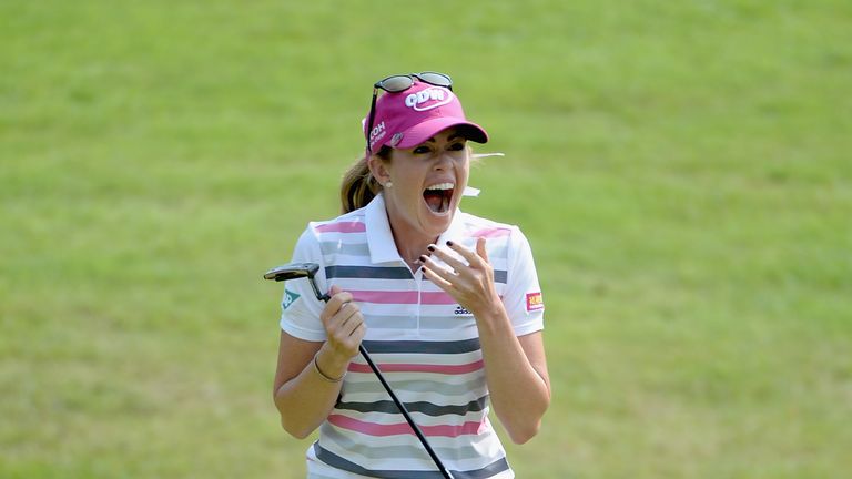 Paula Creamer celebrates after winning the HSBC Champions in a play-off against Azahara Munoz