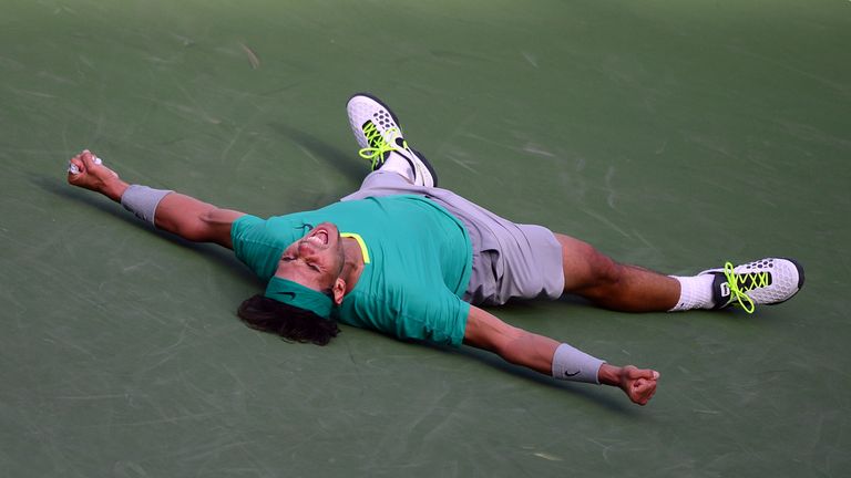 Rafael Nadal of Spain drops to the ground and shouts after defeating Juan Martin Del Potro of Argentina in three sets at the Indian Wells Masters