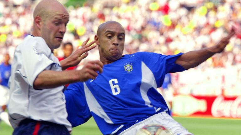 Roberto Carlos intercepts the ball from Danny Mills during the England v Brazil quarter-final match at the 2002 World Cup.