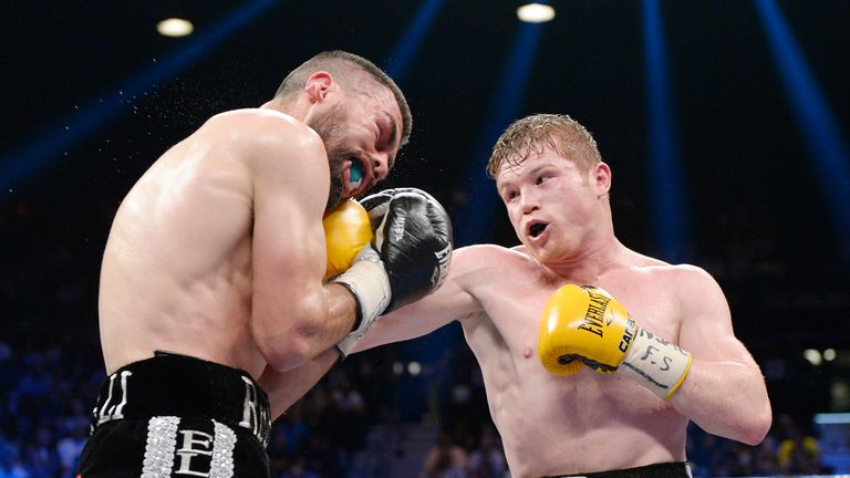 Canelo Alvarez throws a punch against Alfredo Angulo (L) during a non-title super welterweight bout at the MGM Grand