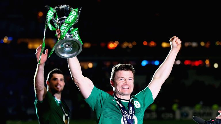 Brian O'Driscoll of Ireland celebrates with the trophy during a lap of honour after helping clinch the Six Nations title with victory over France.
