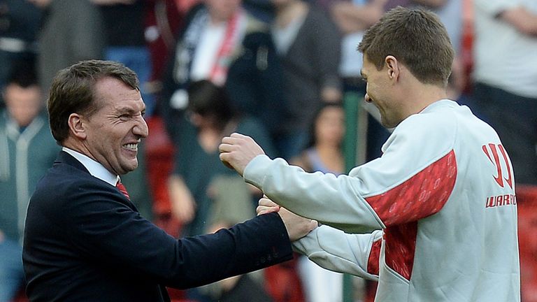 Liverpool manager Brendan Rodgers celebrates with Steven Gerrard after his teams 4-0 win against Tottenham Hotspur, during the Barclays Premier League matc