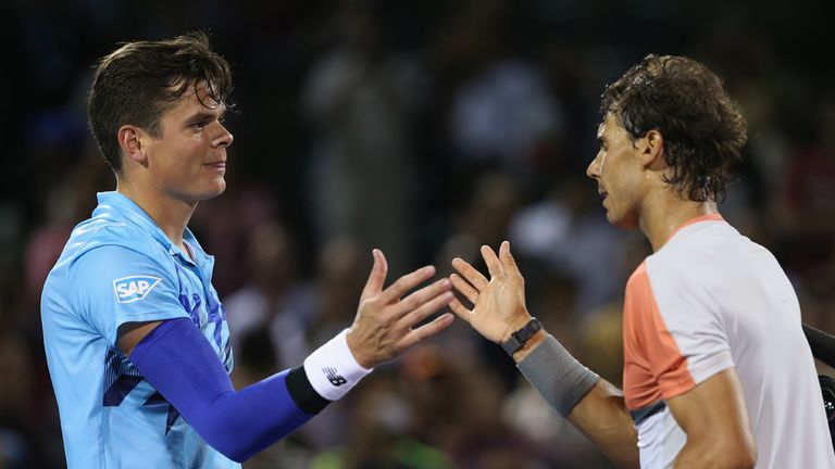  Rafael Nadal of Spain shakes hands at the net after his three set victory against Milos Raonic
