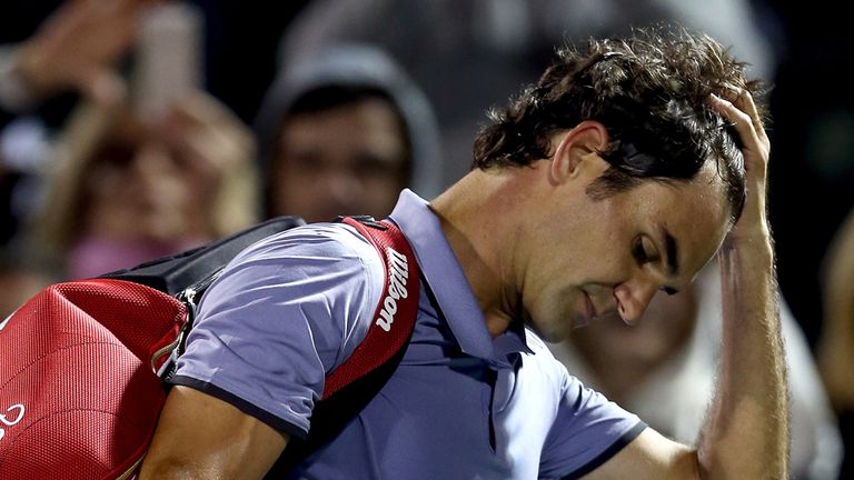  Roger Federer of Switzerland leaves the court after losing to Kei Nishikori at Sony Open