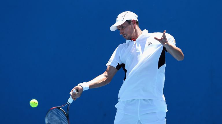 Victor Hanescu of Romania plays a forehand at the Australian Open