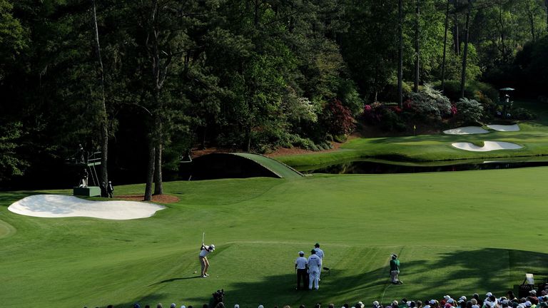 Jason Day of Australia hits his tee shot on the 12th hole at Augusta National