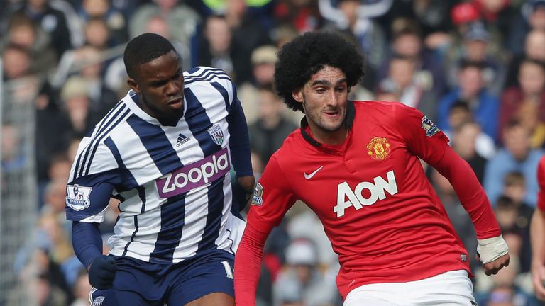 Marouane Fellaini holds off Victor Anichebe as Manchester United take on West Brom at the Hawthorns.